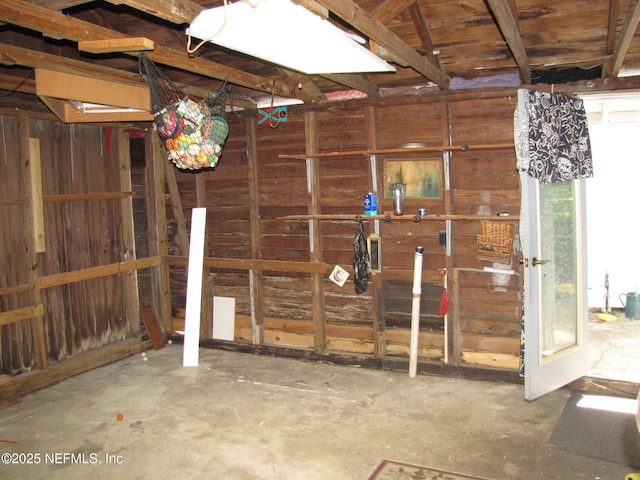 870 Allison St, Jacksonville, FL 32254 - miscellaneous room featuring concrete flooring and wood walls