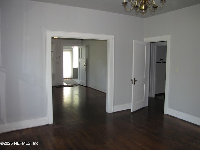 870 Allison St, Jacksonville, FL 32254 - unfurnished room featuring a chandelier, wood finished floors, and baseboards