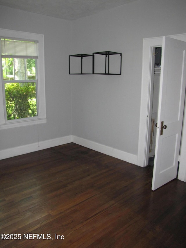 870 Allison St, Jacksonville, FL 32254 - unfurnished room featuring dark wood-style flooring and baseboards
