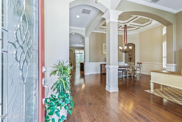 117 Pineta Way, Saint Johns, FL 32259 - foyer with dark wood-style flooring, crown molding, coffered ceiling, a decorative wall, and a wainscoted wall