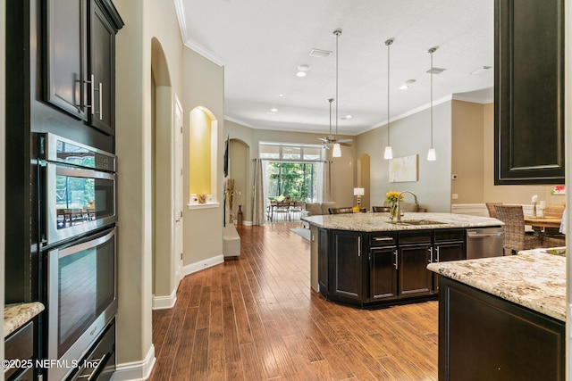 117 Pineta Way, Saint Johns, FL 32259 - kitchen with a sink, arched walkways, a ceiling fan, stainless steel appliances, and ornamental molding