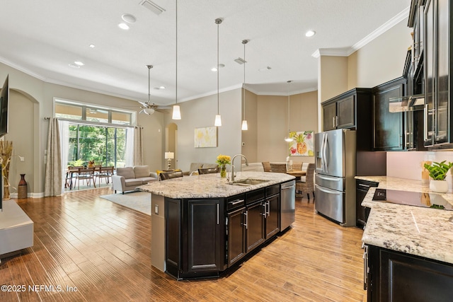 117 Pineta Way, Saint Johns, FL 32259 - kitchen with a sink, arched walkways, stainless steel appliances, open floor plan, and a ceiling fan