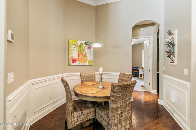 117 Pineta Way, Saint Johns, FL 32259 - dining area featuring arched walkways, wood finished floors, a decorative wall, and wainscoting