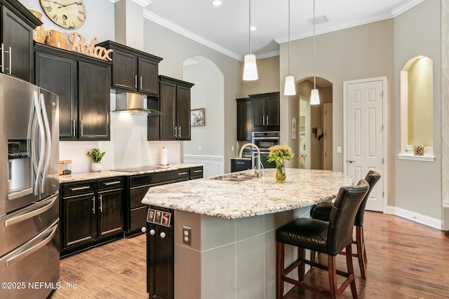 117 Pineta Way, Saint Johns, FL 32259 - kitchen with stainless steel fridge with ice dispenser, a sink, arched walkways, under cabinet range hood, and crown molding