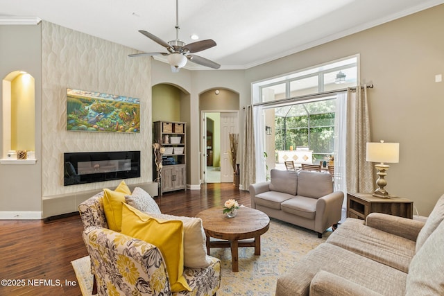 117 Pineta Way, Saint Johns, FL 32259 - living room with crown molding, wood finished floors, a fireplace, baseboards, and arched walkways
