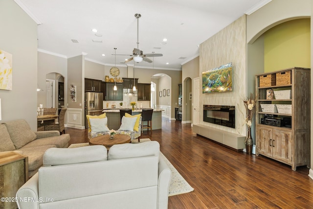 117 Pineta Way, Saint Johns, FL 32259 - living room with a ceiling fan, crown molding, recessed lighting, arched walkways, and dark wood-type flooring