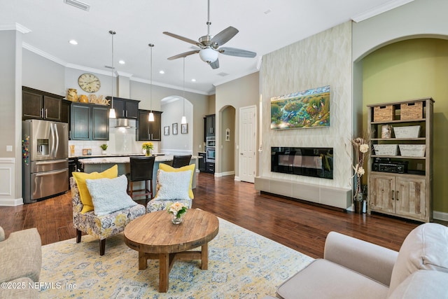 117 Pineta Way, Saint Johns, FL 32259 - living area with arched walkways, a ceiling fan, ornamental molding, recessed lighting, and dark wood-style floors