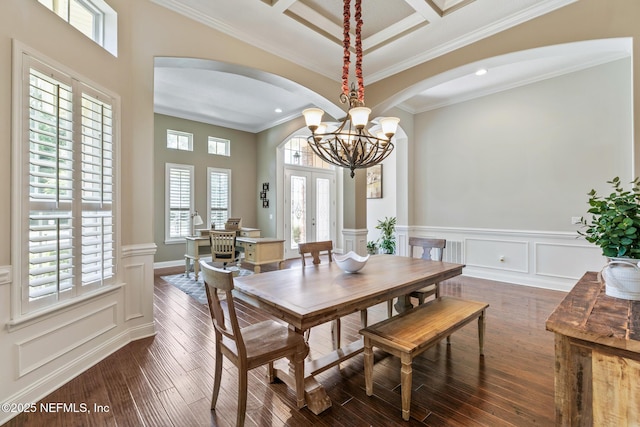 117 Pineta Way, Saint Johns, FL 32259 - dining room featuring arched walkways, dark wood finished floors, ornamental molding, a chandelier, and wainscoting