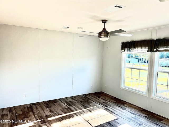 11648 E Confederate Dr, Glen St Mary, FL 32040 - unfurnished room featuring a ceiling fan, wood finished floors, and healthy amount of natural light