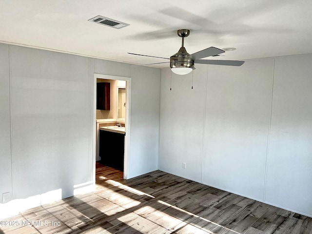11648 E Confederate Dr, Glen St Mary, FL 32040 - spare room with ceiling fan and wood finished floors