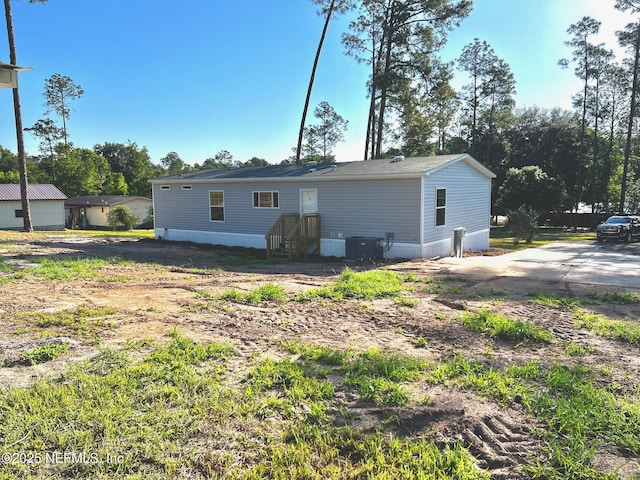 11648 E Confederate Dr, Glen St Mary, FL 32040 - back of property with central AC