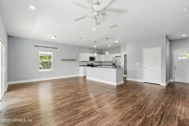 9706 Sibbald Rd, Jacksonville, FL 32219 - unfurnished living room with baseboards, ceiling fan, dark wood-style flooring, a sink, and recessed lighting