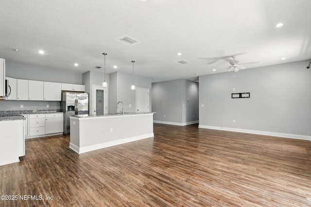 9706 Sibbald Rd, Jacksonville, FL 32219 - kitchen with stainless steel fridge with ice dispenser, recessed lighting, a ceiling fan, a sink, and an island with sink