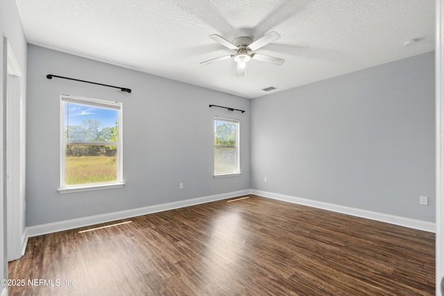 9706 Sibbald Rd, Jacksonville, FL 32219 - spare room featuring ceiling fan, wood finished floors, a textured ceiling, and baseboards