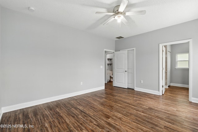 9706 Sibbald Rd, Jacksonville, FL 32219 - unfurnished bedroom with dark wood-style flooring, baseboards, and ceiling fan