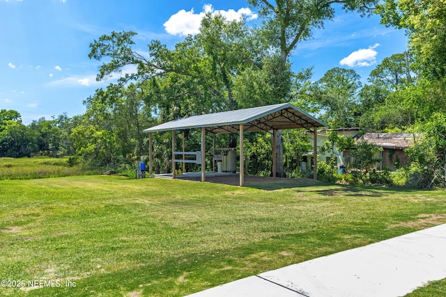 9706 Sibbald Rd, Jacksonville, FL 32219 - view of property's community with a detached carport and a yard