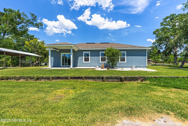 9706 Sibbald Rd, Jacksonville, FL 32219 - rear view of house with a yard and a patio area