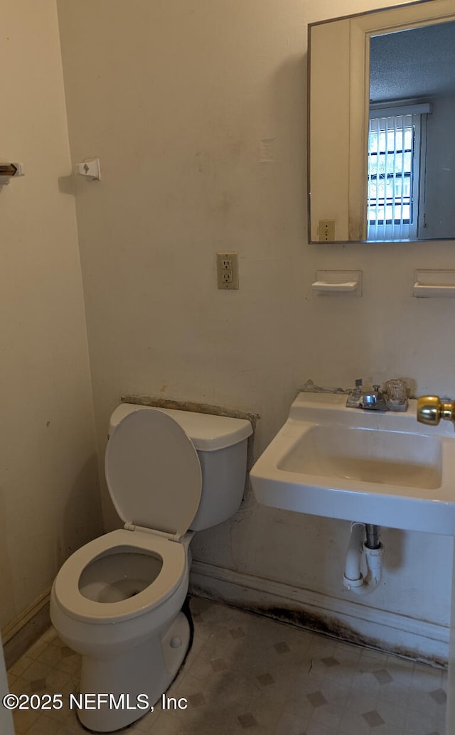 4649 Fairleigh Ave, Jacksonville, FL 32208 - bathroom with toilet and a sink