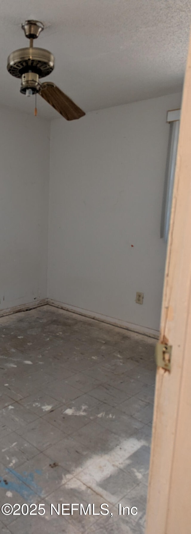 4649 Fairleigh Ave, Jacksonville, FL 32208 - empty room featuring baseboards and ceiling fan