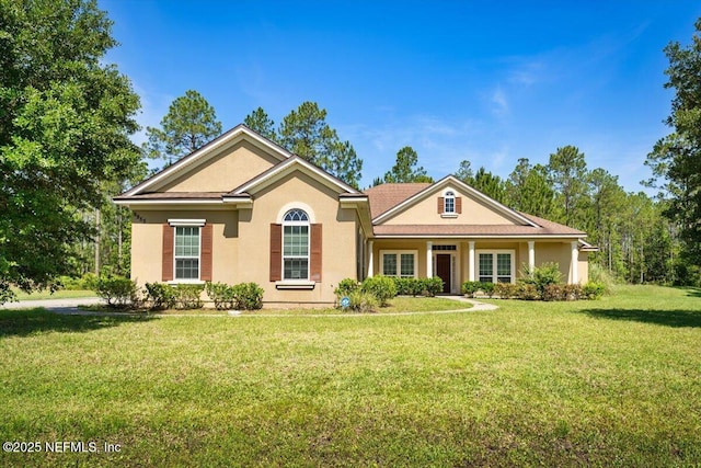 9955 Kings Crossing Dr E, Jacksonville, FL 32219 - ranch-style home with a front lawn and stucco siding