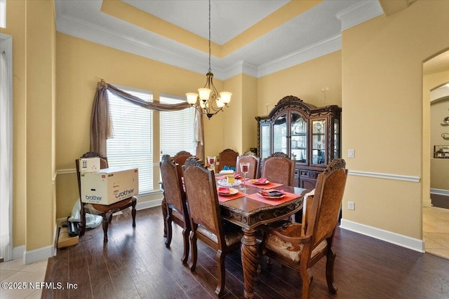 9955 Kings Crossing Dr E, Jacksonville, FL 32219 - dining room with a chandelier, wood finished floors, ornamental molding, arched walkways, and a raised ceiling