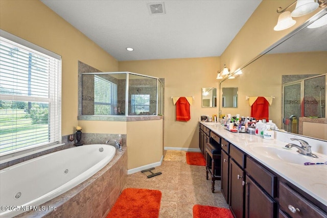 9955 Kings Crossing Dr E, Jacksonville, FL 32219 - full bath featuring a shower stall, double vanity, a whirlpool tub, and baseboards