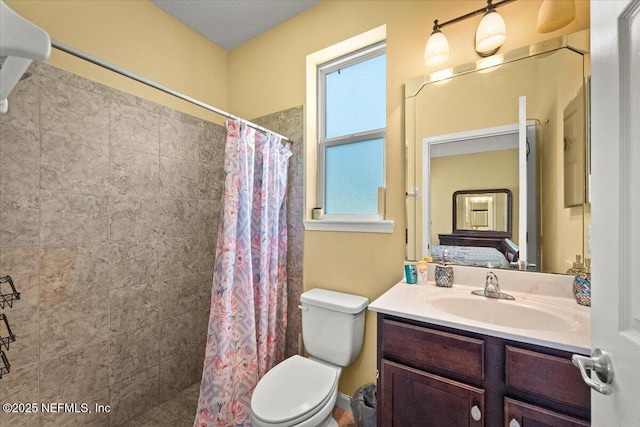 9955 Kings Crossing Dr E, Jacksonville, FL 32219 - full bathroom featuring toilet, vanity, and a tile shower