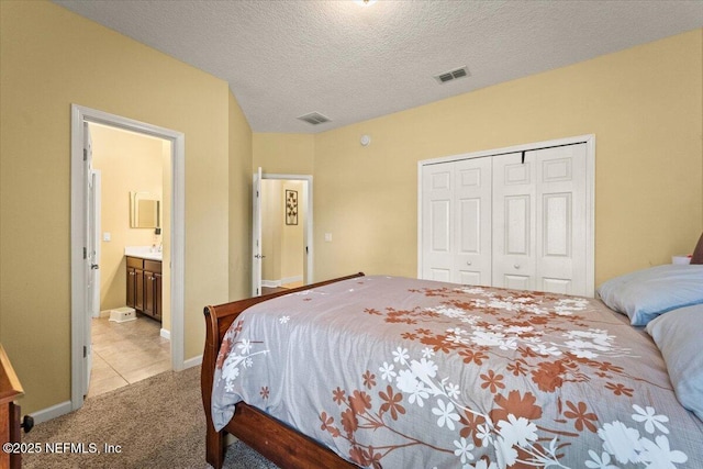9955 Kings Crossing Dr E, Jacksonville, FL 32219 - carpeted bedroom featuring a closet and a textured ceiling