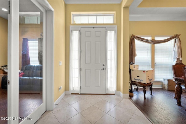 9955 Kings Crossing Dr E, Jacksonville, FL 32219 - entrance foyer with light tile patterned flooring, crown molding, and baseboards