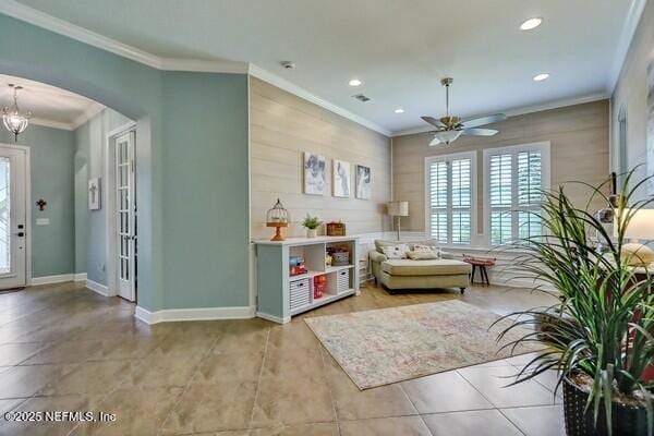 167 Royal Lake Dr, Ponte Vedra, FL 32081 - tiled living area featuring a ceiling fan, crown molding, arched walkways, recessed lighting, and baseboards
