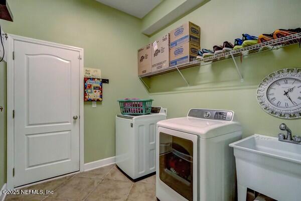 167 Royal Lake Dr, Ponte Vedra, FL 32081 - washroom with independent washer and dryer, light tile patterned floors, and baseboards