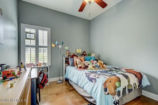 167 Royal Lake Dr, Ponte Vedra, FL 32081 - bedroom with baseboards, wood finished floors, and a ceiling fan