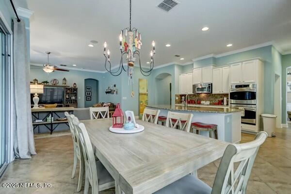 167 Royal Lake Dr, Ponte Vedra, FL 32081 - dining area with ornamental molding, arched walkways, recessed lighting, a chandelier, and a ceiling fan