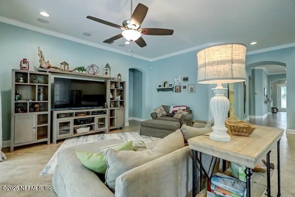 167 Royal Lake Dr, Ponte Vedra, FL 32081 - living room with arched walkways, ceiling fan, ornamental molding, recessed lighting, and tile patterned flooring