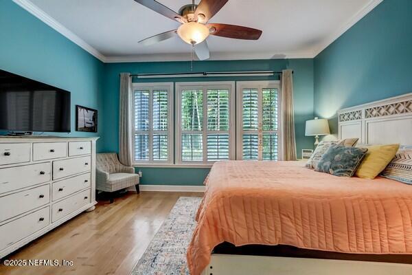 167 Royal Lake Dr, Ponte Vedra, FL 32081 - bedroom featuring wood finished floors, crown molding, ceiling fan, and baseboards