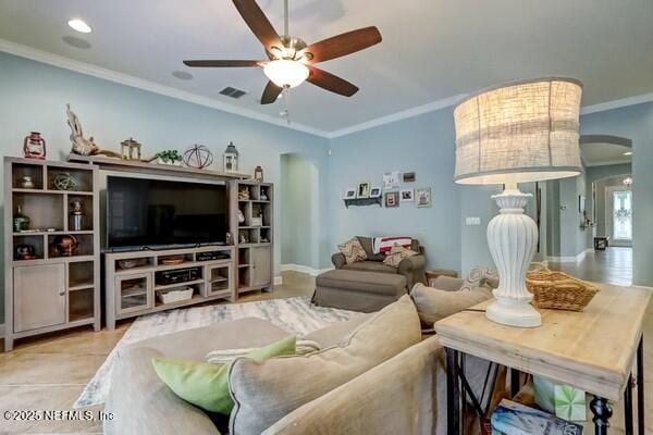 167 Royal Lake Dr, Ponte Vedra, FL 32081 - living area with arched walkways, a ceiling fan, ornamental molding, and baseboards