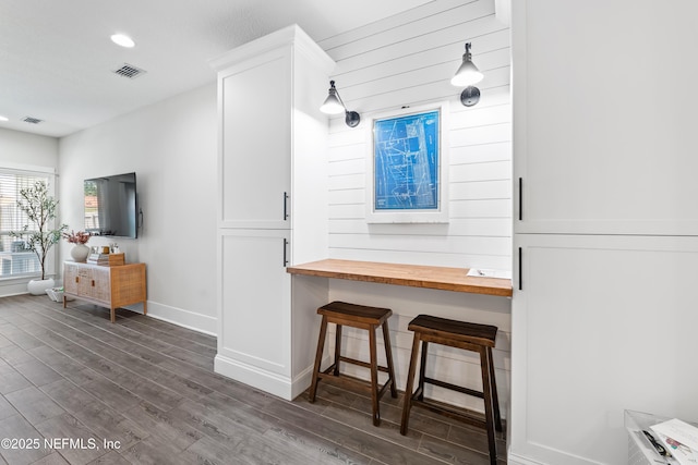 622 2nd Ave N, Jacksonville Beach, FL 32250 - kitchen featuring wooden counters, dark wood-style floors, white cabinetry, baseboards, and recessed lighting