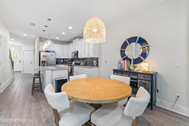 622 2nd Ave N, Jacksonville Beach, FL 32250 - dining room with wood finished floors, baseboards, and recessed lighting