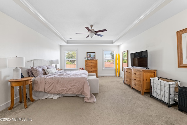 622 2nd Ave N, Jacksonville Beach, FL 32250 - bedroom with light carpet, a raised ceiling, baseboards, a ceiling fan, and crown molding