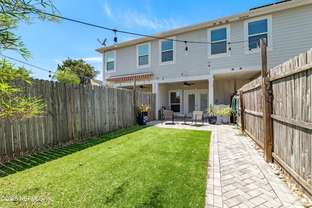 622 2nd Ave N, Jacksonville Beach, FL 32250 - back of property with ceiling fan, a patio, and board and batten siding