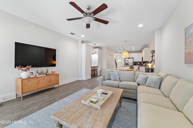622 2nd Ave N, Jacksonville Beach, FL 32250 - living room featuring a ceiling fan, wood finished floors, recessed lighting, and baseboards