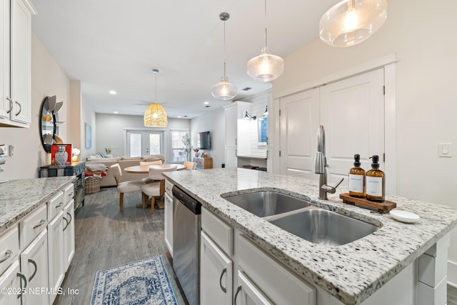 622 2nd Ave N, Jacksonville Beach, FL 32250 - kitchen with a sink, stainless steel dishwasher, white cabinets, open floor plan, and recessed lighting