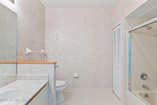 50 Rivers Edge Ln, Palm Coast, FL 32137 - full bathroom with tile patterned floors, vanity, toilet, washtub / shower combination, and baseboards