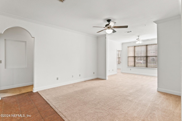 13810 Sutton Park Dr N Unit 511, Jacksonville, FL 32224 - empty room featuring ornamental molding, ceiling fan, arched walkways, baseboards, and tile patterned floors