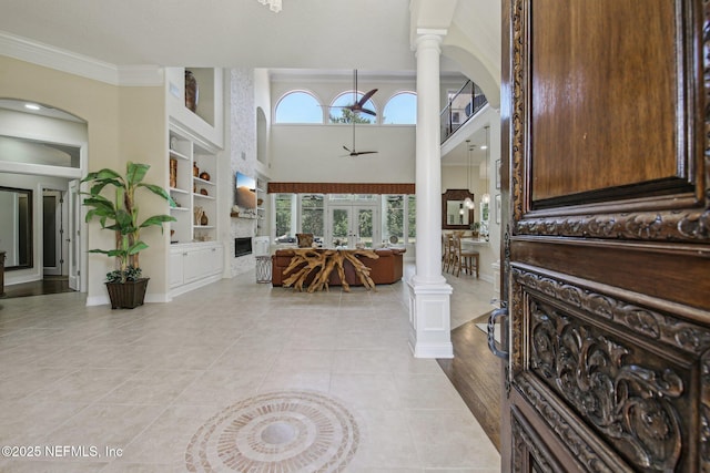2579 Woodgrove Rd, Fleming Island, FL 32003 - entryway with decorative columns, light tile patterned floors, baseboards, and ornamental molding