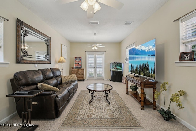 2579 Woodgrove Rd, Fleming Island, FL 32003 - carpeted living room with ceiling fan and baseboards