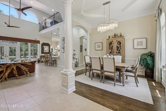 2579 Woodgrove Rd, Fleming Island, FL 32003 - dining space featuring ornate columns, arched walkways, ceiling fan, french doors, and ornamental molding