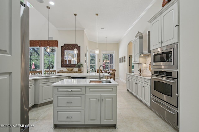 2579 Woodgrove Rd, Fleming Island, FL 32003 - kitchen with stainless steel appliances, a sink, wall chimney range hood, a warming drawer, and ornamental molding