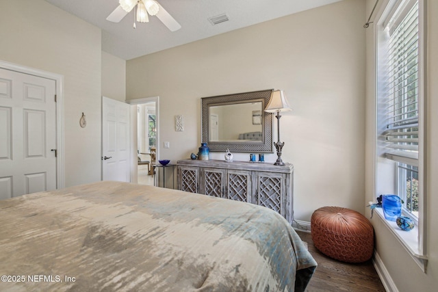 2579 Woodgrove Rd, Fleming Island, FL 32003 - bedroom featuring multiple windows, wood finished floors, baseboards, lofted ceiling, and ceiling fan