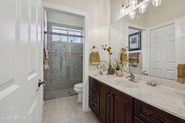 2579 Woodgrove Rd, Fleming Island, FL 32003 - bathroom featuring vanity, toilet, a stall shower, and tile patterned flooring